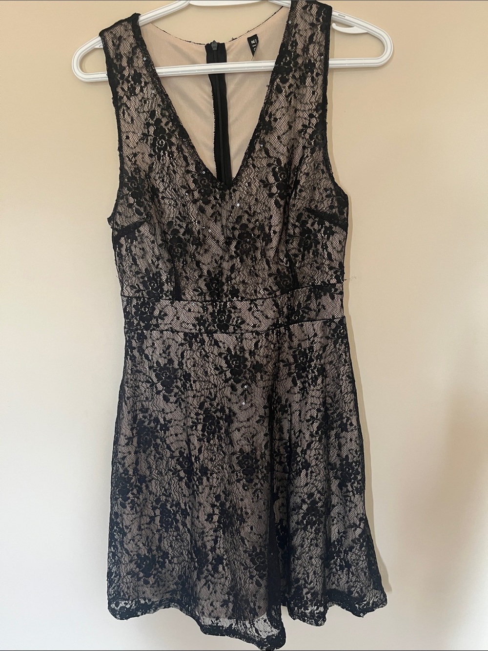 Sleeveless Black Lace Overlay V-Neck Dress with sparkles.